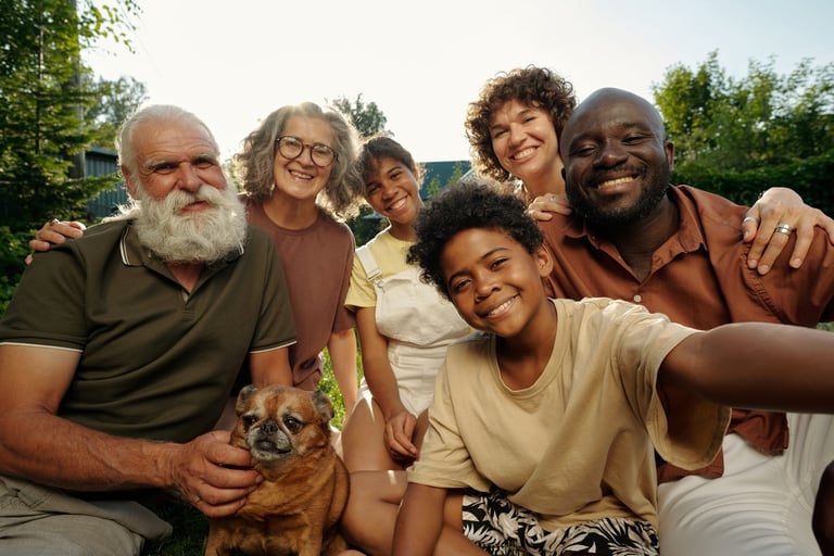 Diverse multigenerational family with dog outdoors
